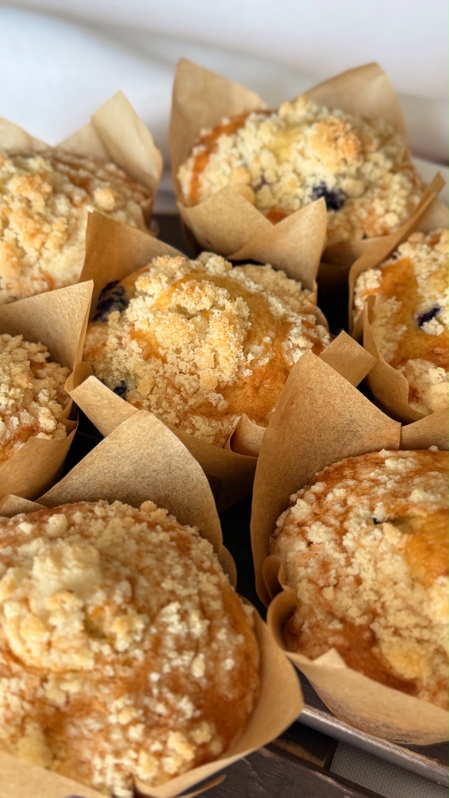 Blueberry crumble muffins with golden butter topping